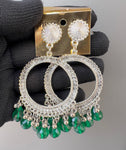 Round silver green jhumkas.