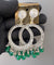 Round silver green jhumkas.